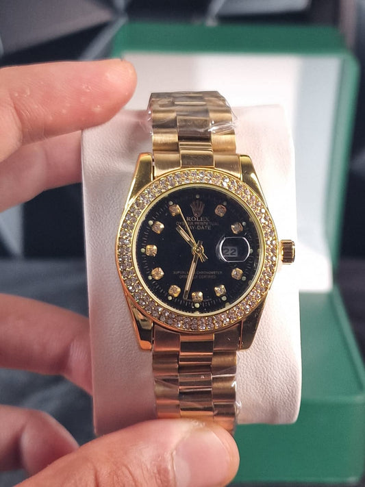 Montre Rolex day date en acier et or avec diamants